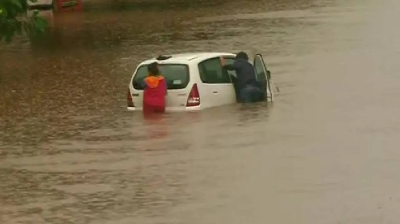 Heavy Rain Lashes Bhubaneswar; Car Gets Stuck On Waterlogged Road Near Iskcon