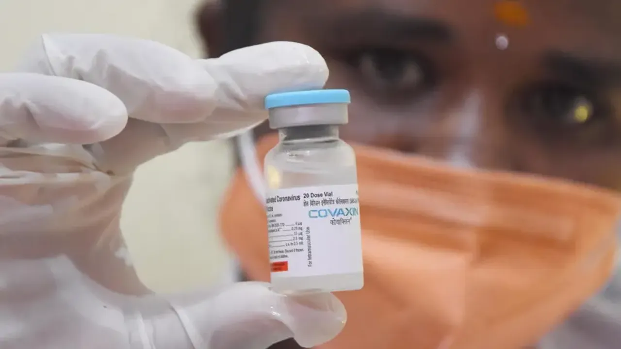 A health worker shows a vial of Covaxin dose