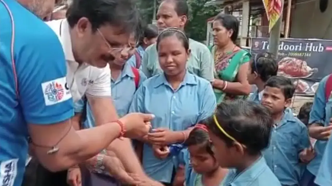 Minister Samir Dash Distributes Candies To Students