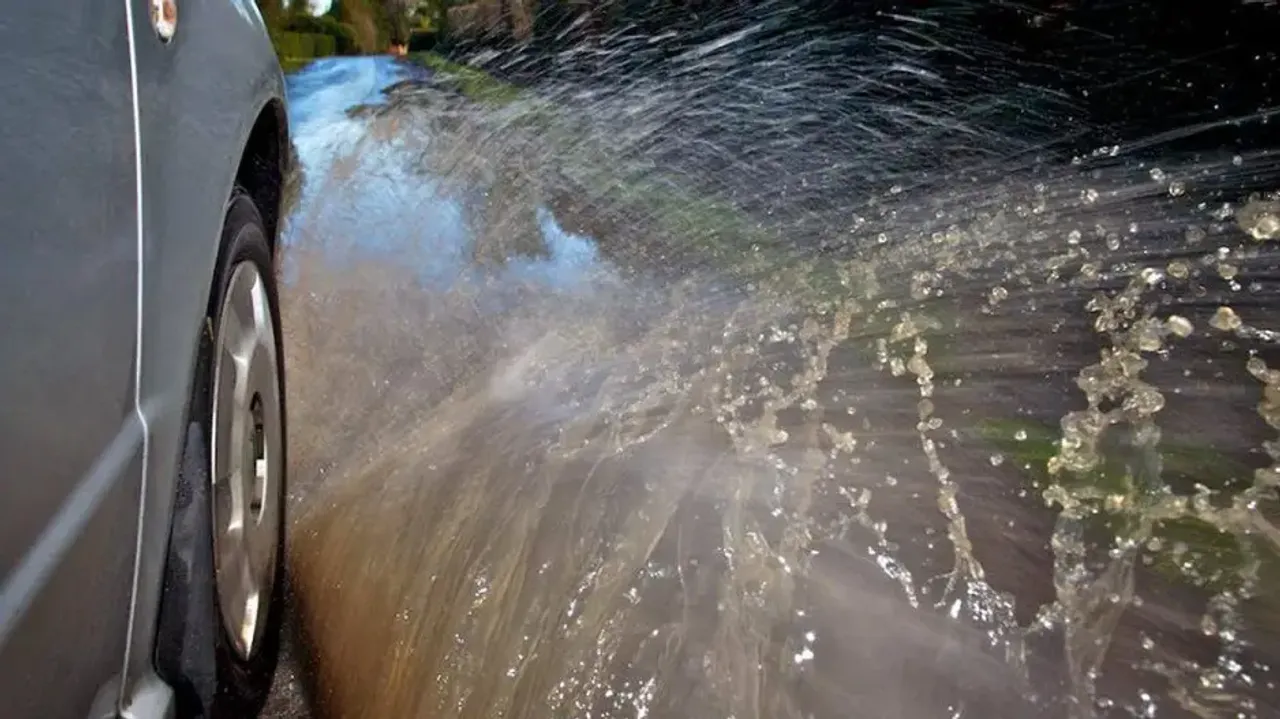 Car Tyre Splashing Water