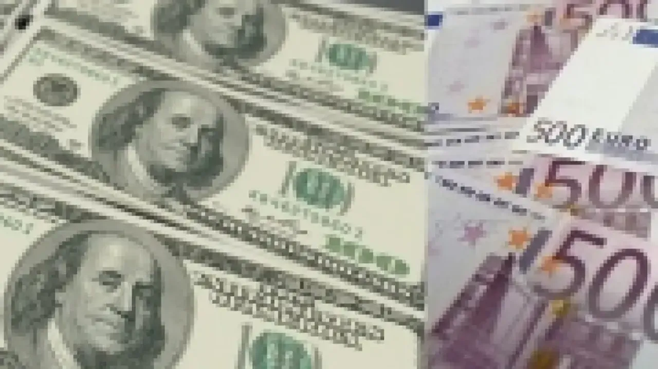 Euro reaches parity with dollar for the first time in 20 years