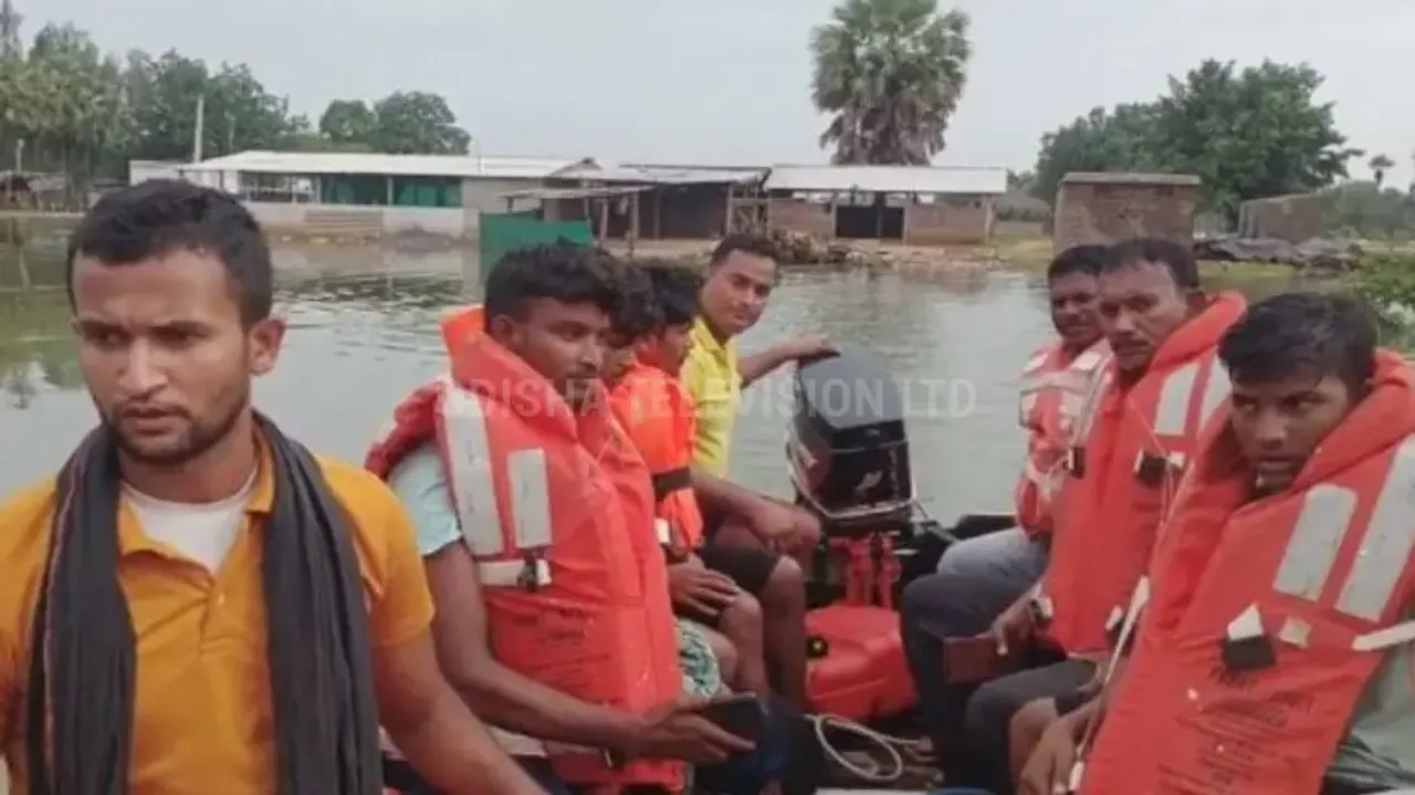 Odisha fire dept personnel rescue 4 youths from flood affected area in Malkangiri