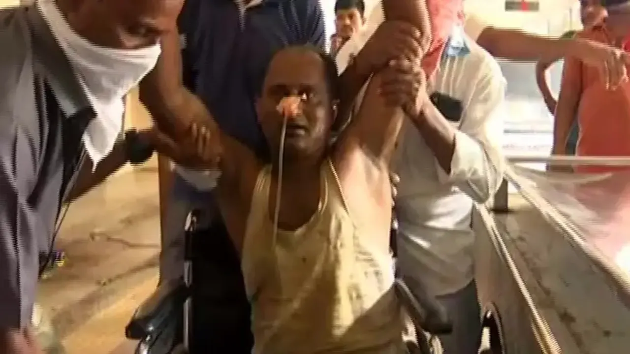 The victim being taken to hospital 