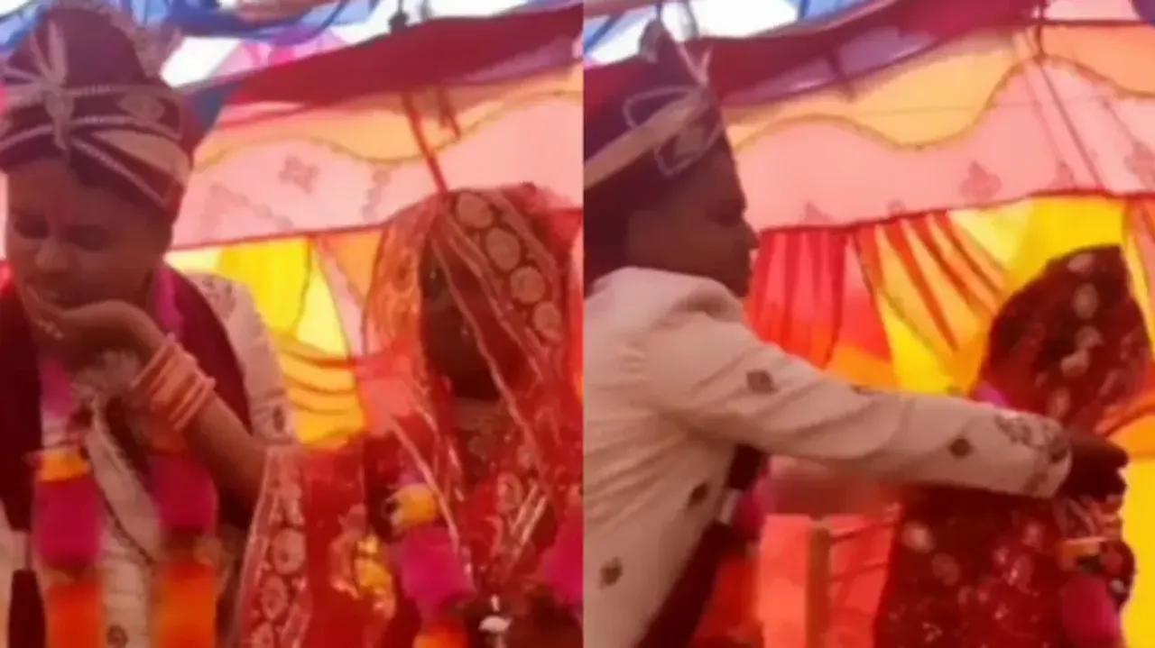 Dulha & dulhan force feed ‘Ladoos’ to each other, bride gives groom a tight slap