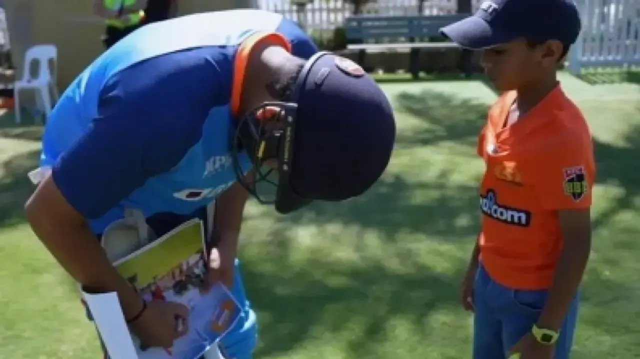 Rohit Sharma gives autograph