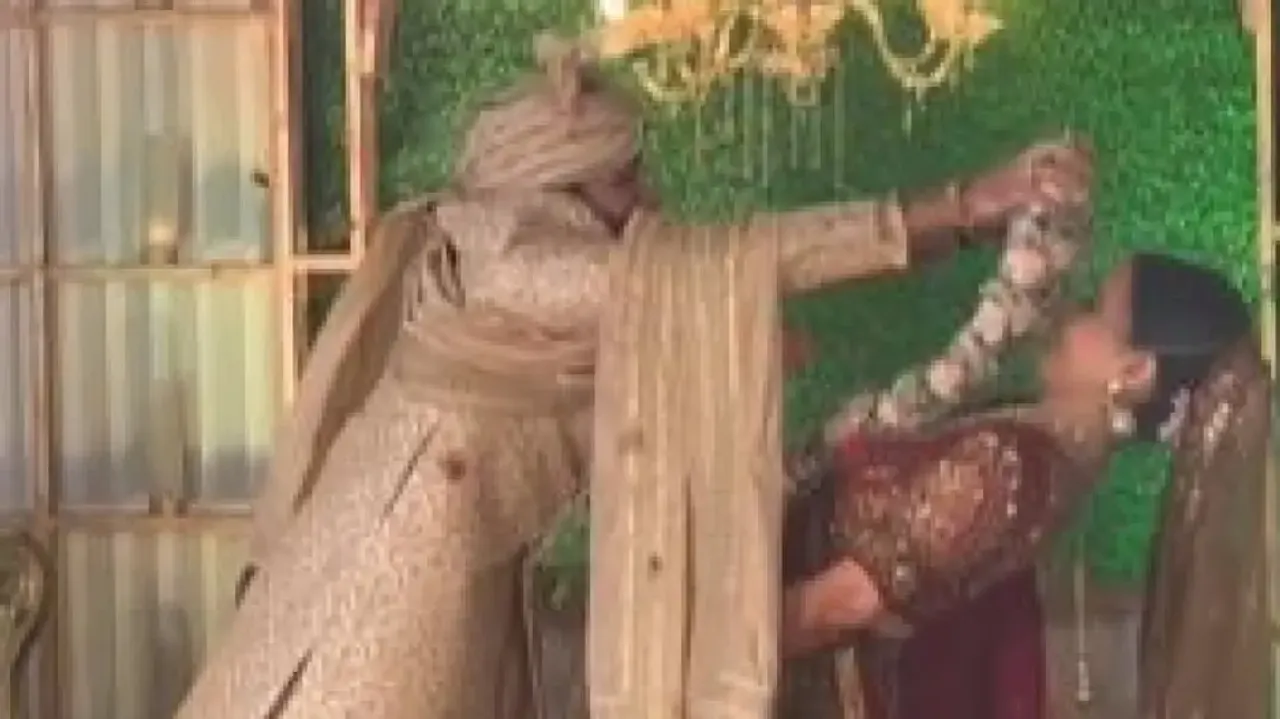 Watch: Bride impresses internet with her 'Matrix Movie Effect' during varmala