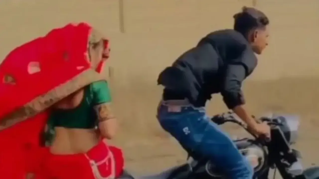 Man performs jaw-dropping stunts on bike while wife rides pillion – Watch video