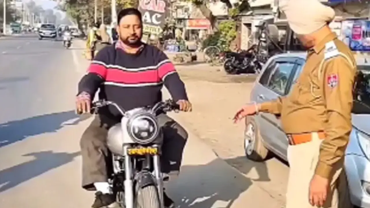 Cops left speechless after intercepting Royal Enfield biker without helmet, watch