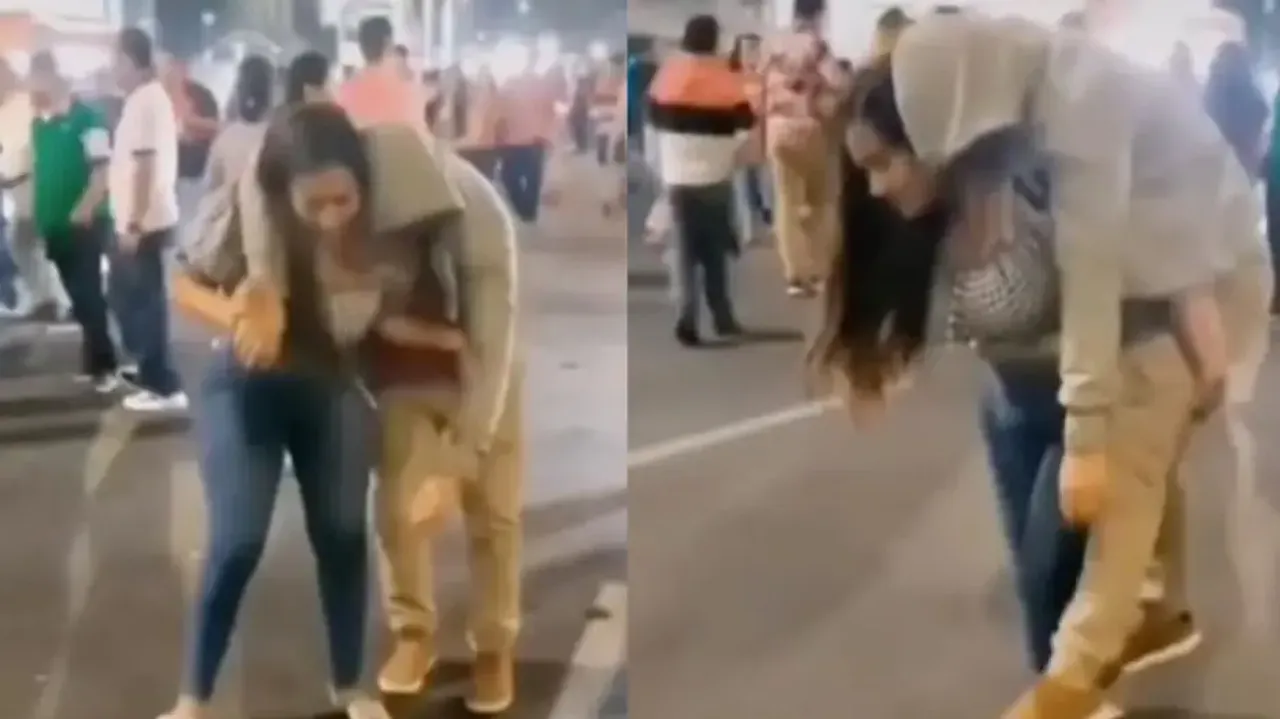 Caring girlfriend carries drunk boyfriend on her back, video goes viral