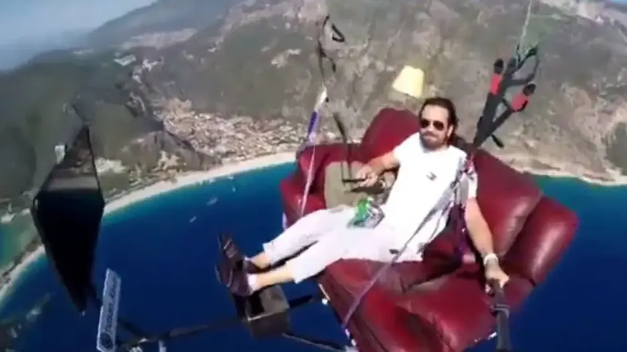 Swag! Man goes paragliding on couch, creates living room experience midair; watch