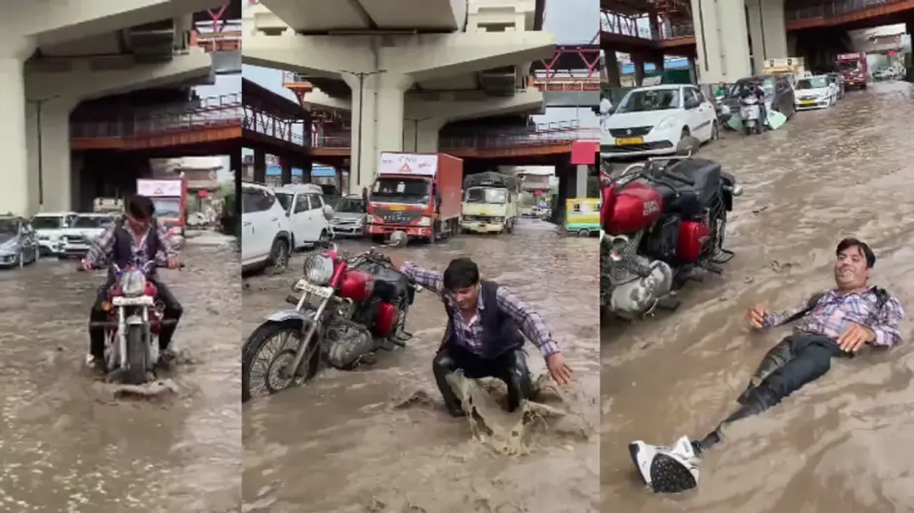 Youth lies down on waterlogged busy road after parking Royal Enfield, watch