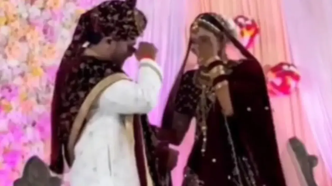 Bride and groom break into tears on wedding stage