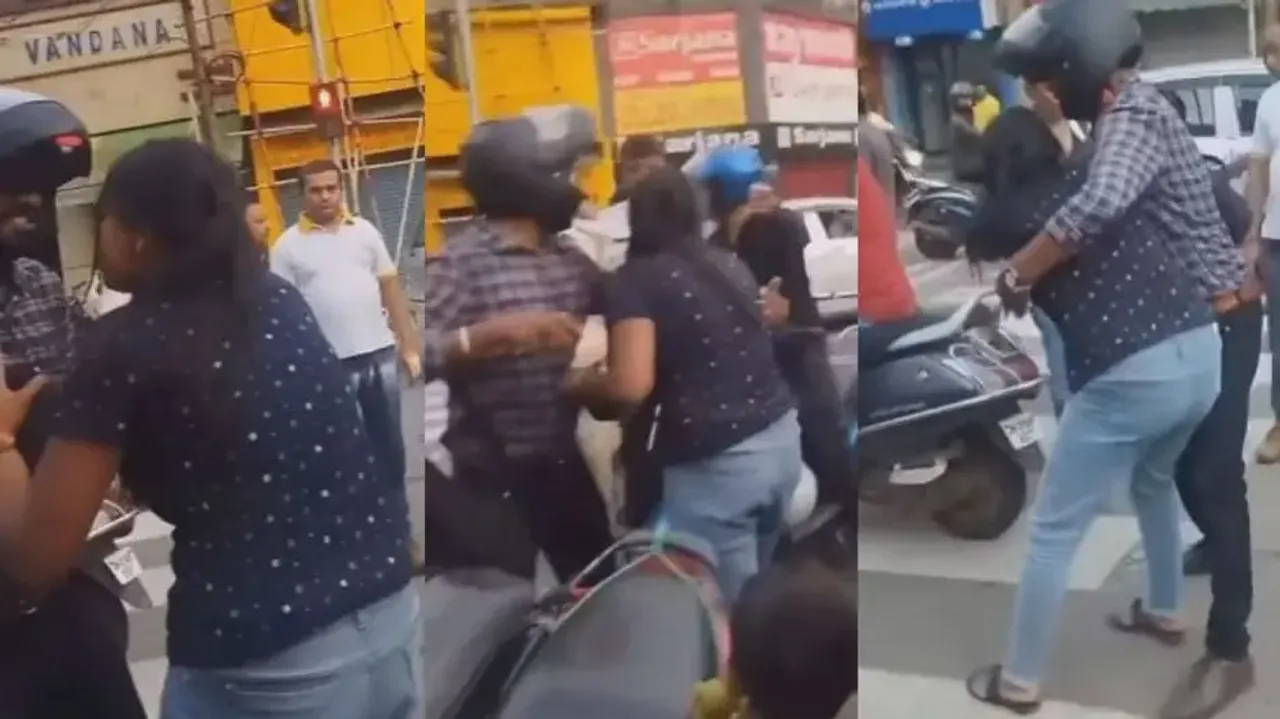 Furious woman fights with man on busy street, watch high-voltage drama