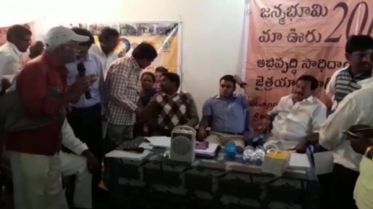 Andhra Babus distribute doles in Odisha villages