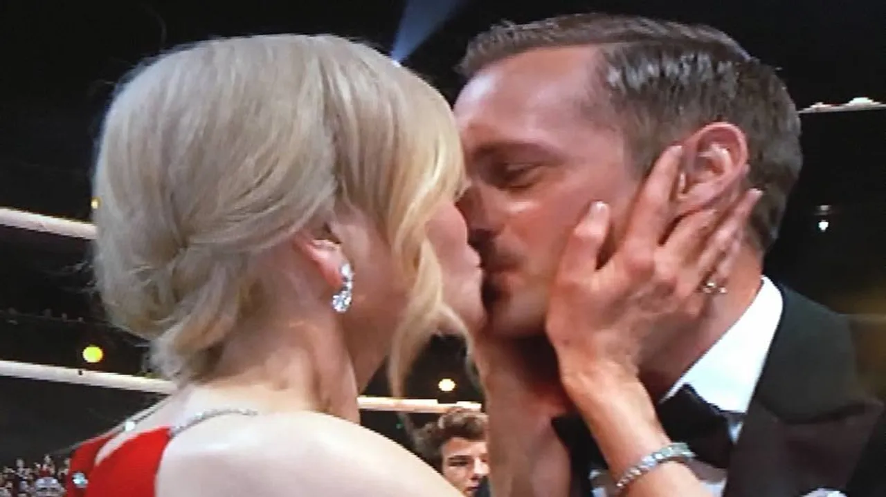 Kidman locks lips with Skarsgard, her husband claps away