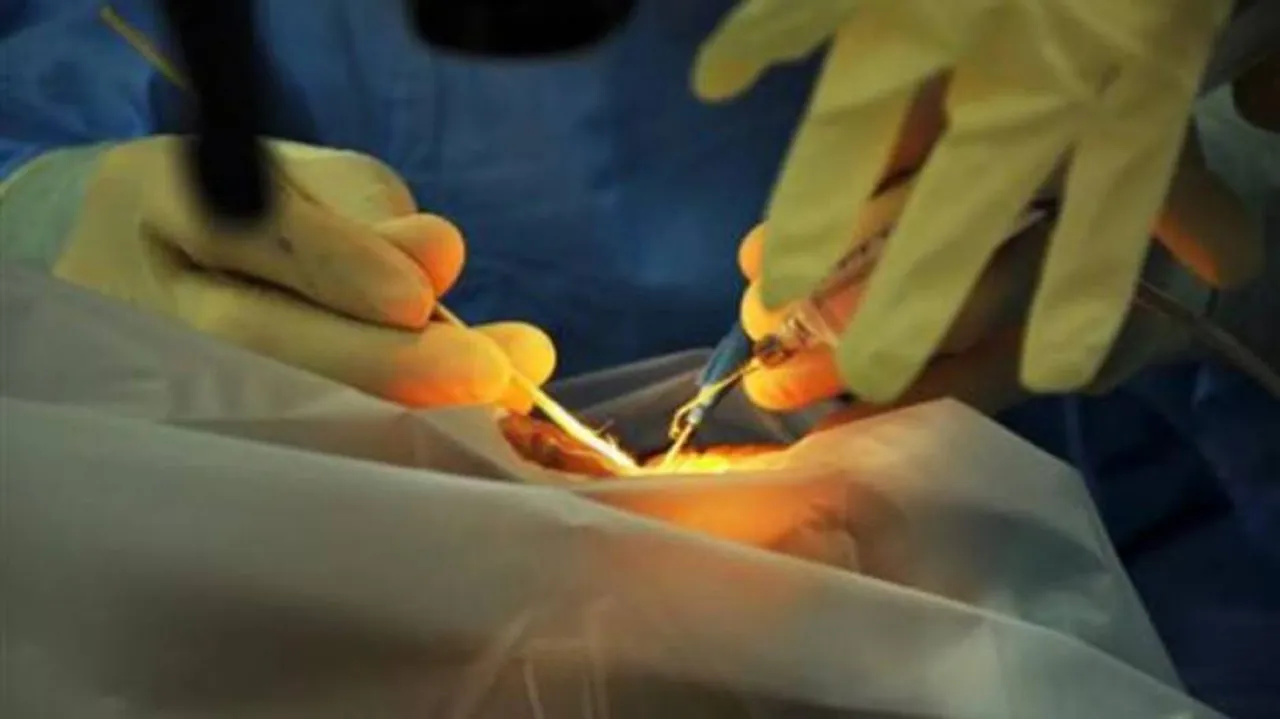 UP doctor stitches up patient under mobile torchlight