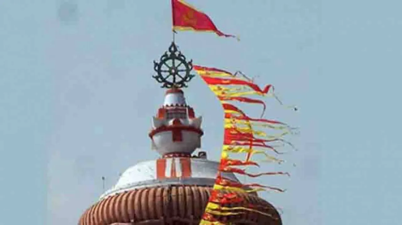 Regular-size 'Patitapabana Bana' affixed atop Puri Srimandir