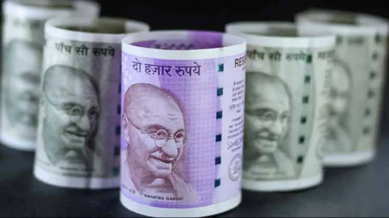 Rupee tops 71 per dollar as RBI lowers growth forecast