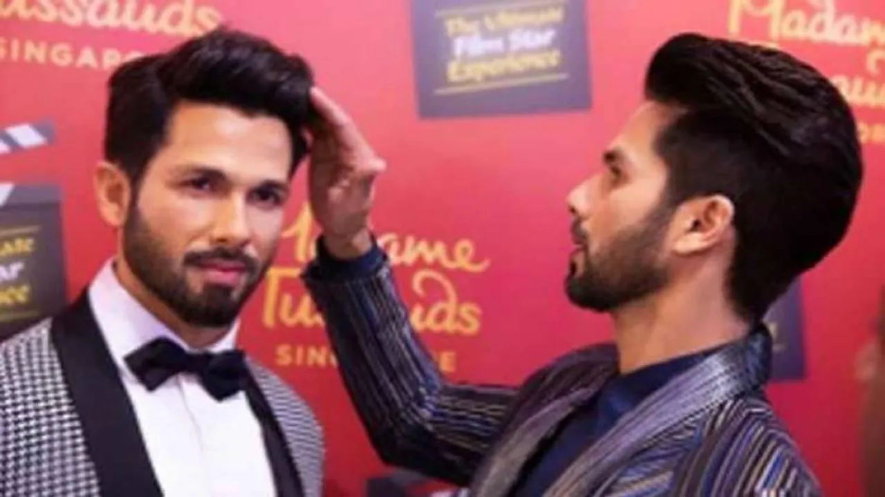 Shahid poses with his wax statue in Singapore