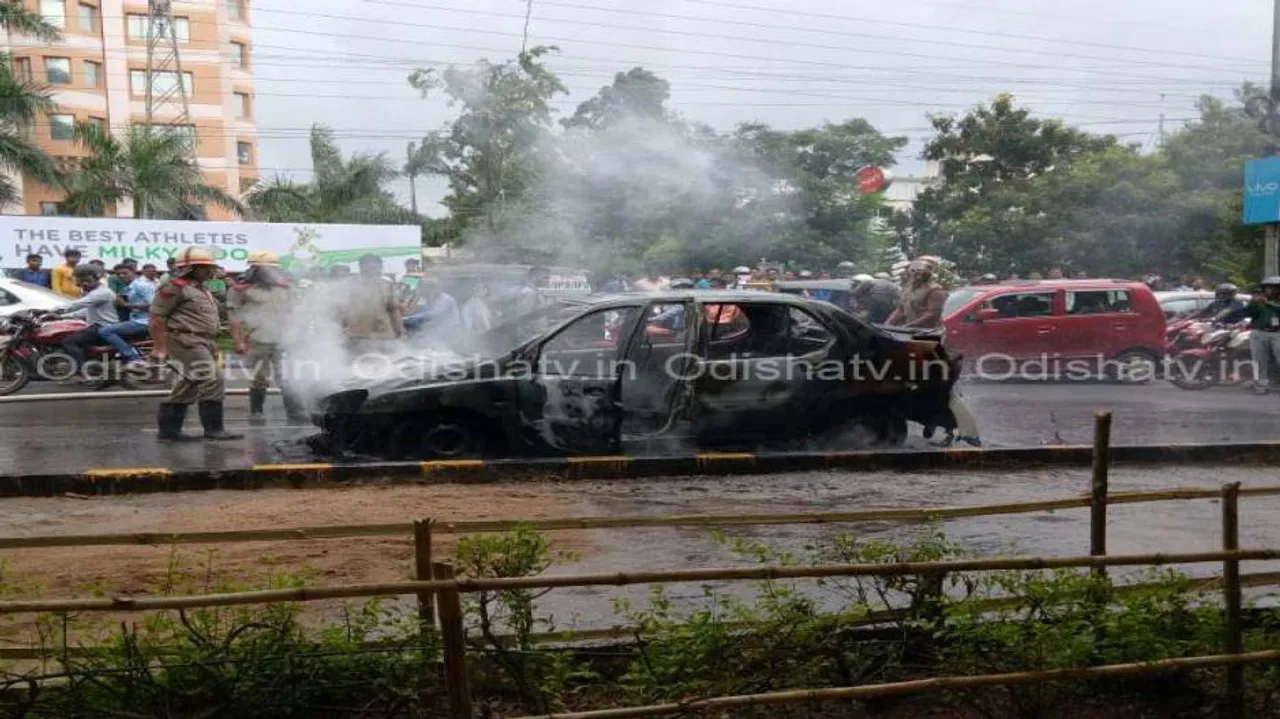 Moving car catches fire; narrow escape for passengers