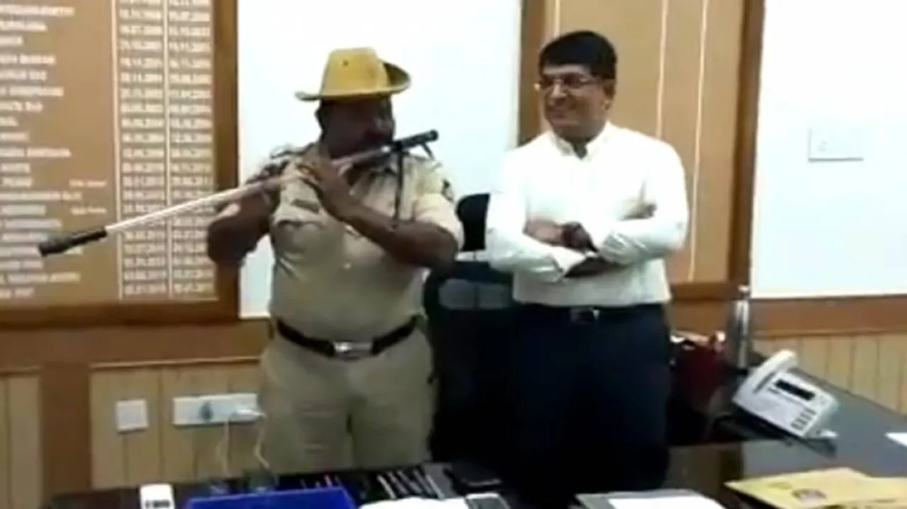 Cop turns 'lathi' into flute to play folk songs, video goes viral