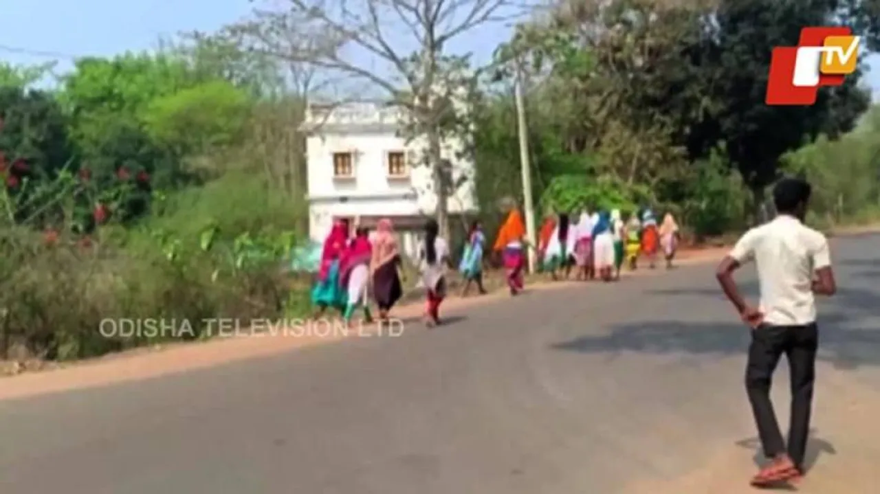 Tribal girl students do a foot-march to meet Collector in Mayurbhanj