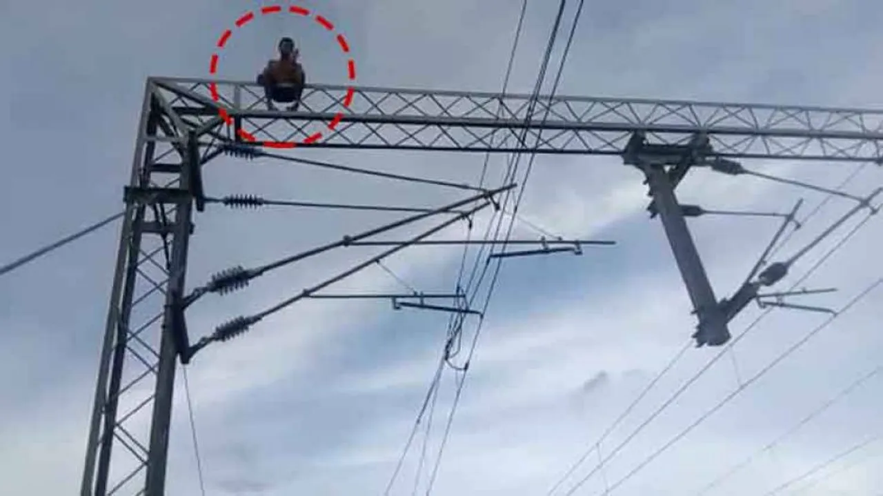 Man climbs atop electric tower at railway station; rescued