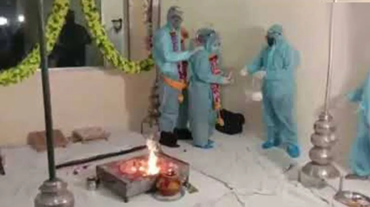 COVID Era: Couple Ties Knot In PPE Kits; Infected Groom Likely To Face Music For Norms Violation