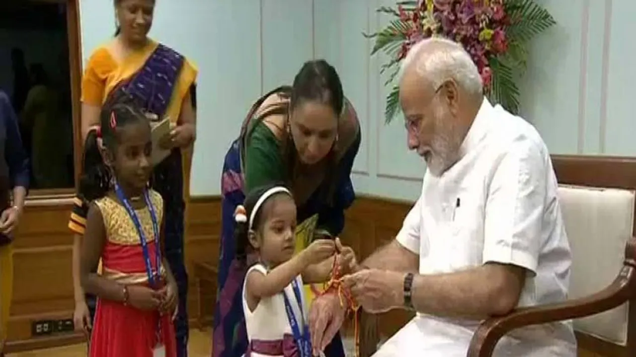 Children, women tie 'rakhi' to PM Modi