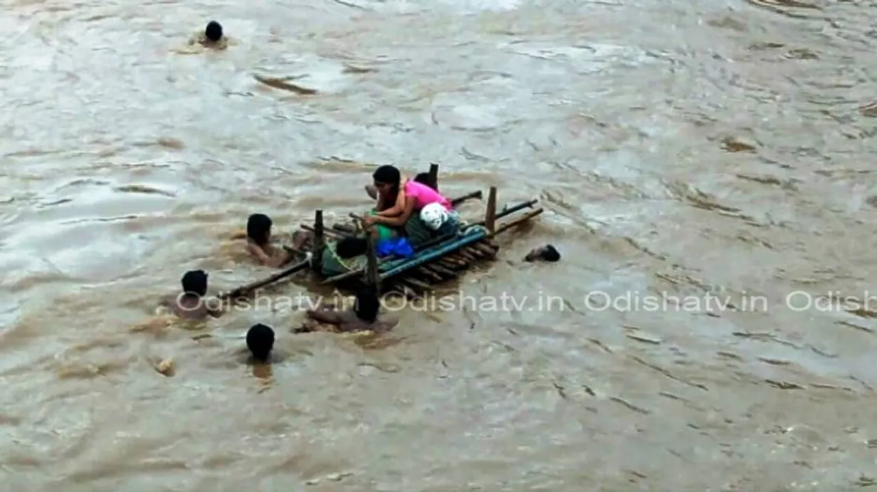 Unhealthy picture: Expectant mother carried across river in bamboo raft