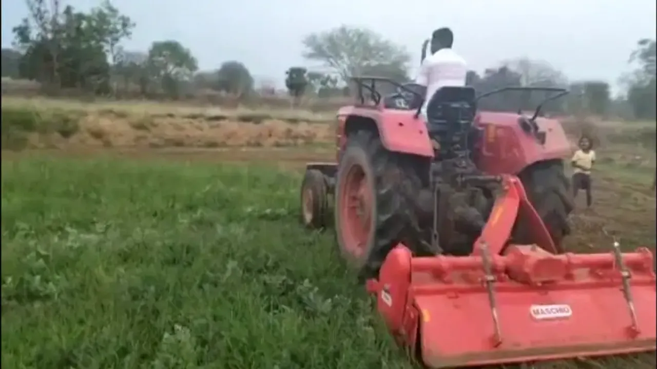 Farmer runs tractor over watermelon field
