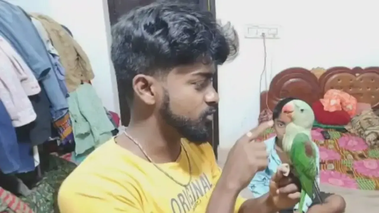 Chinmay Mohanto with his pet parrot