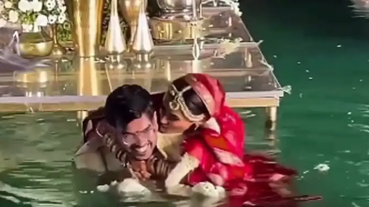 Bride pushes groom into pool, duo starts romancing in water; watch