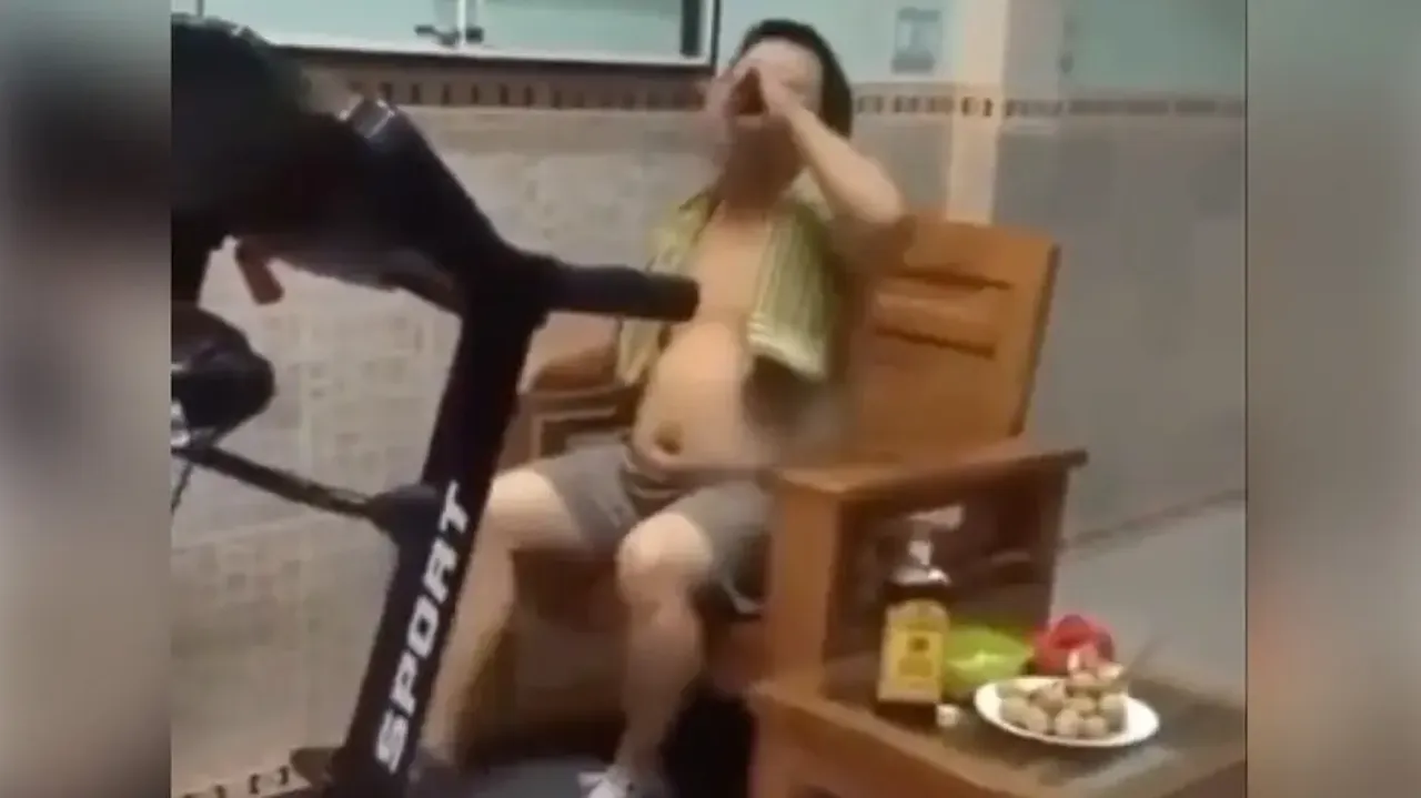 Laziest fitness freak ‘walks’ on treadmill while binging on alcohol & snacks; watch