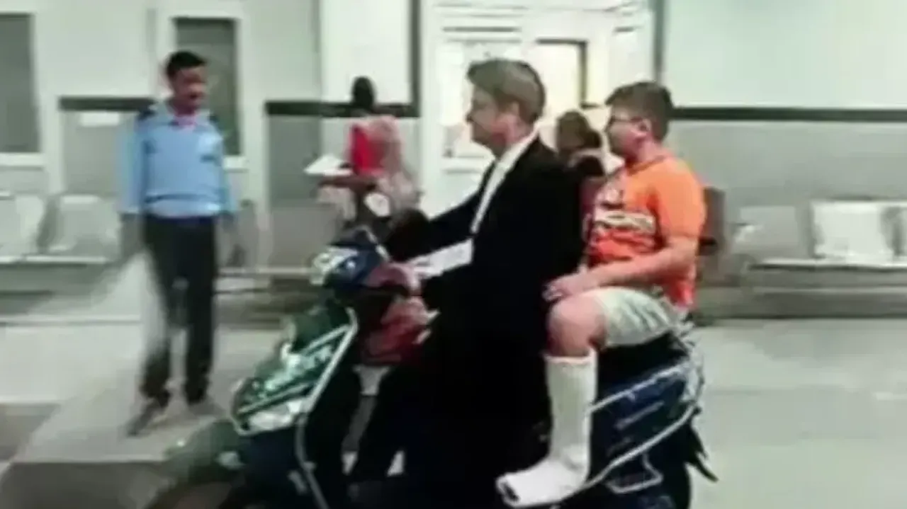 3 Idiots rerun: No wheelchairs in hospital, advocate takes injured son to 3rd floor on scooter