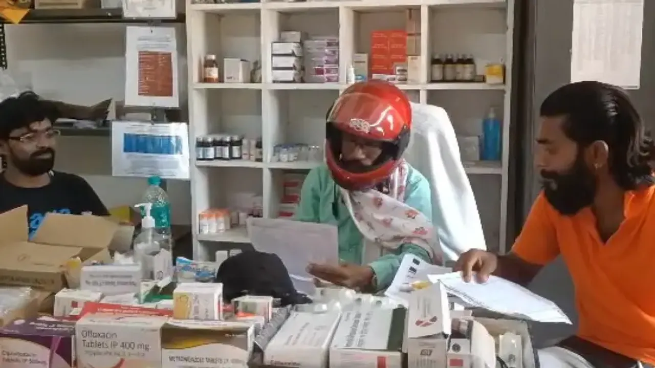 Doctor treats patient wearing helmet