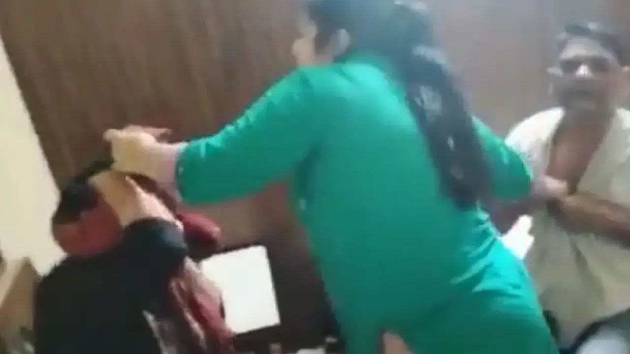 Wife catches man with another woman in hotel room, thrashes both with slippers; watch