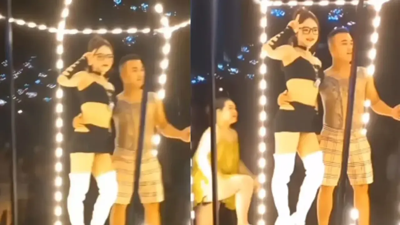 Man walks near stripper to click photos, gets spotted by wife; watch what happens next