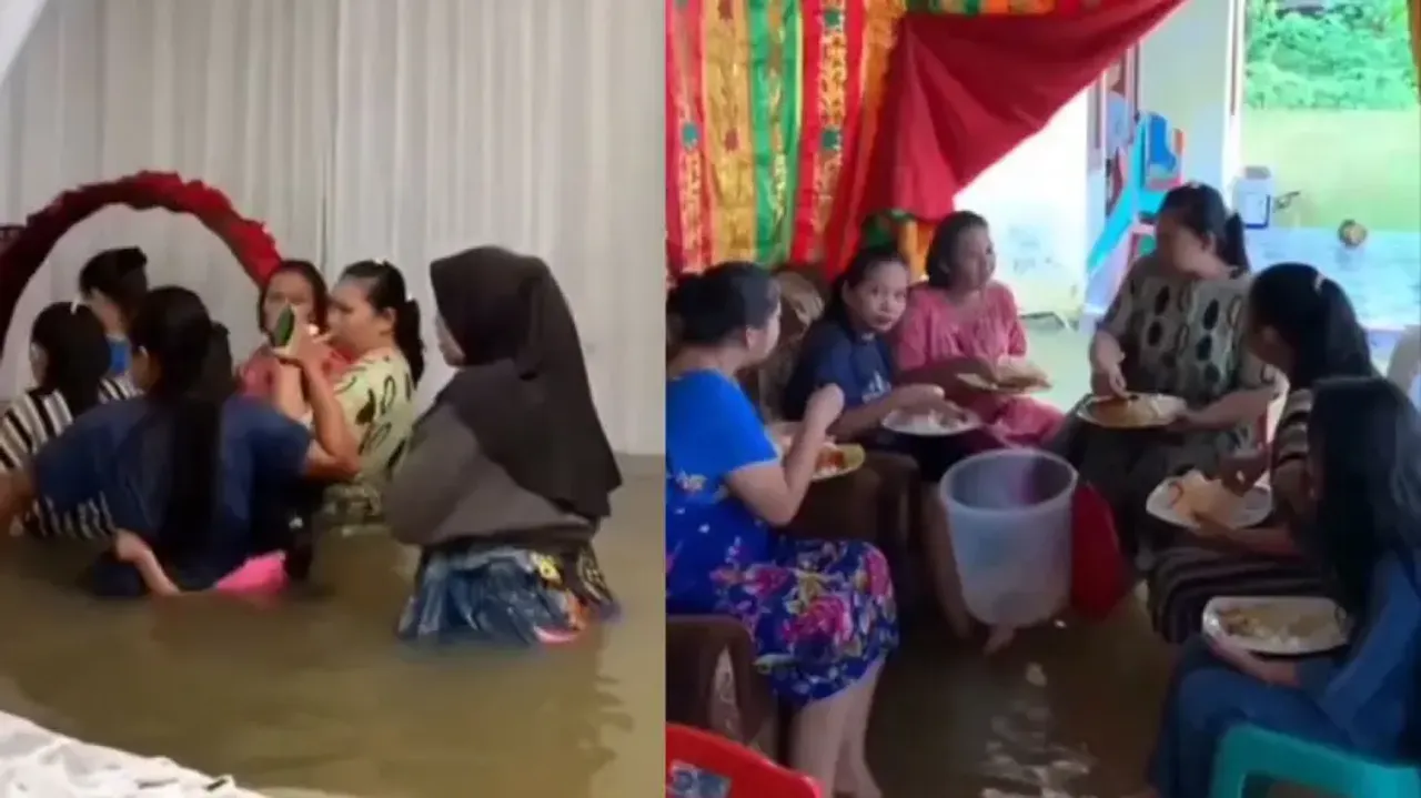 Group of women brave floodwater, enjoy wedding feast in waist-deep water; watch