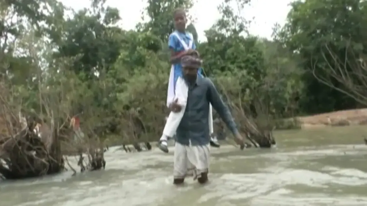 Man Crosses River Carrying Daughter To School 