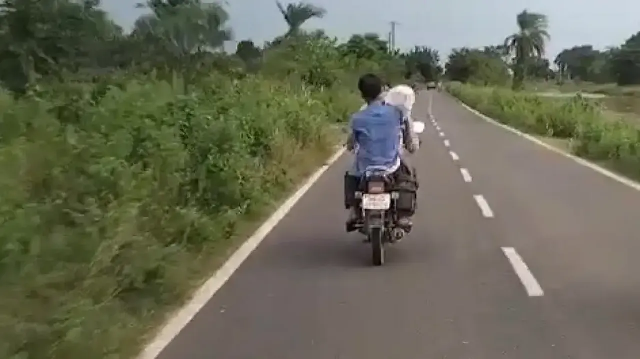Man Carries Son's Body On Bike