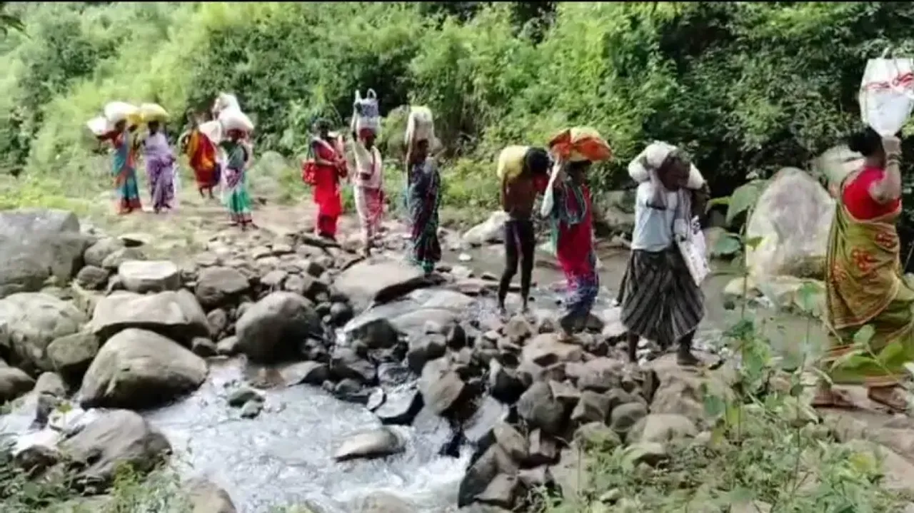 Kandhamal PDS beneficiaries climb hill to collect rice