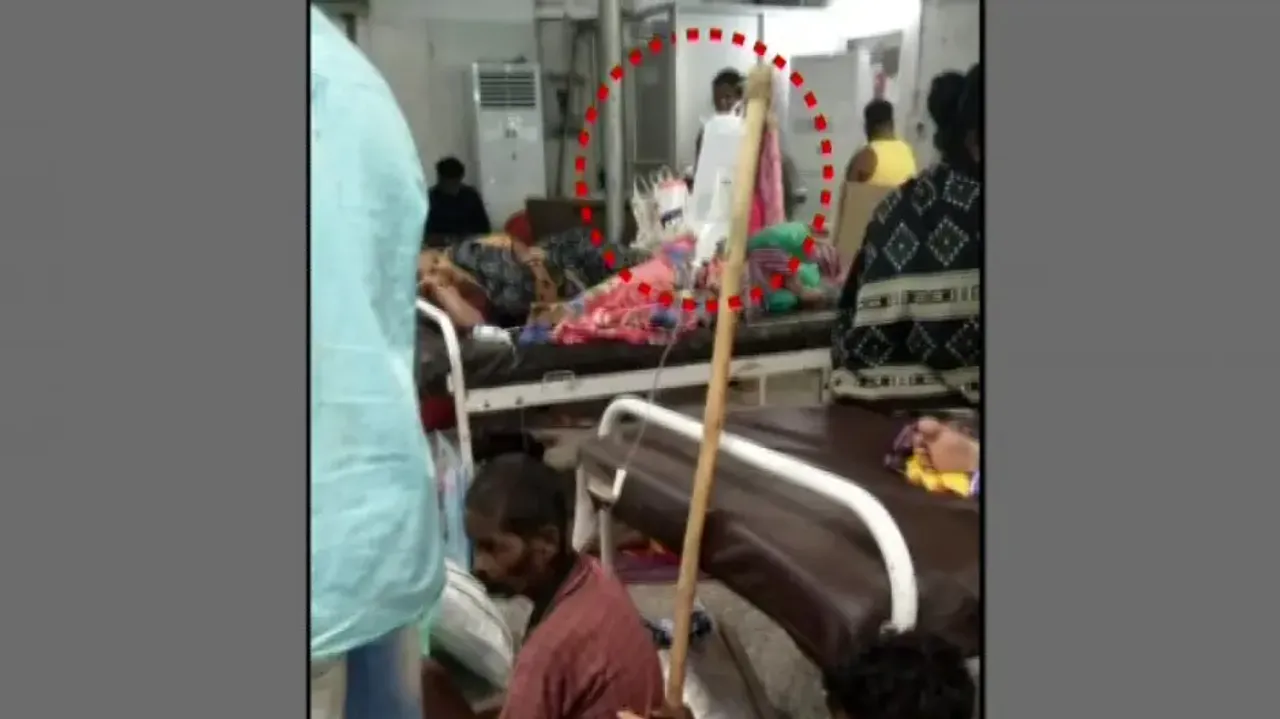 Saline bottle on stick at SCB