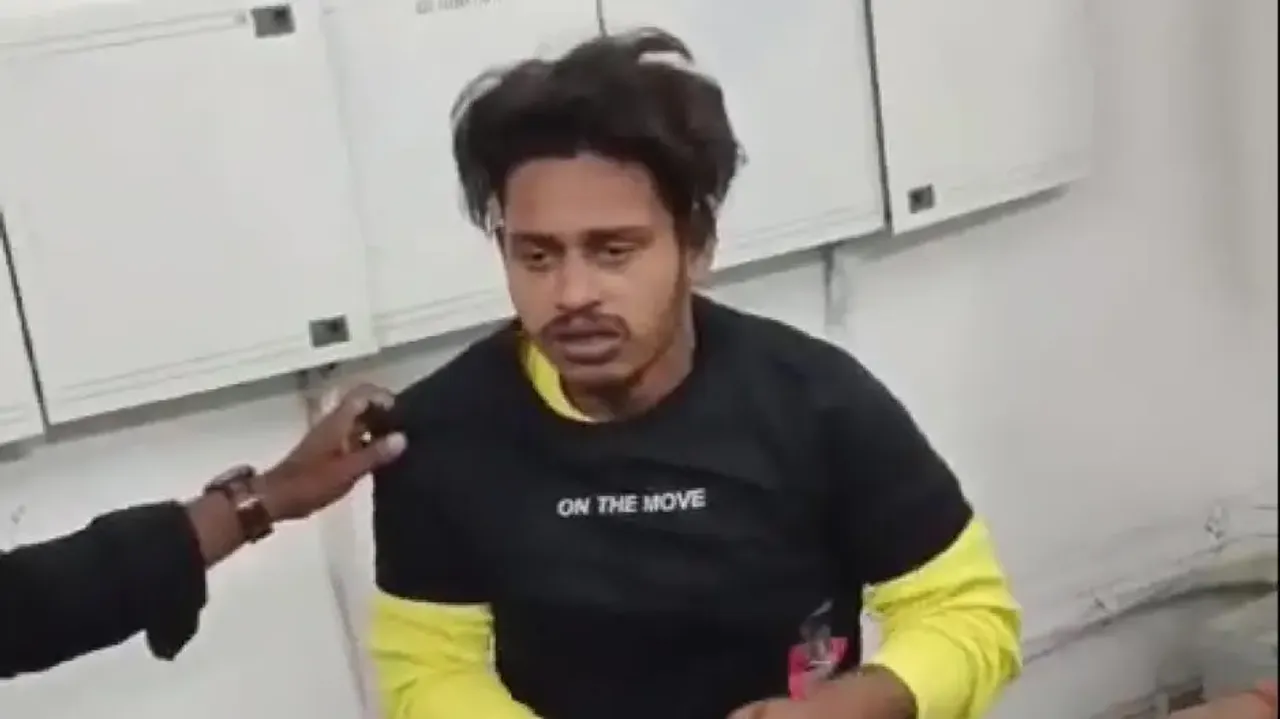 Youth stealing clothes from mall