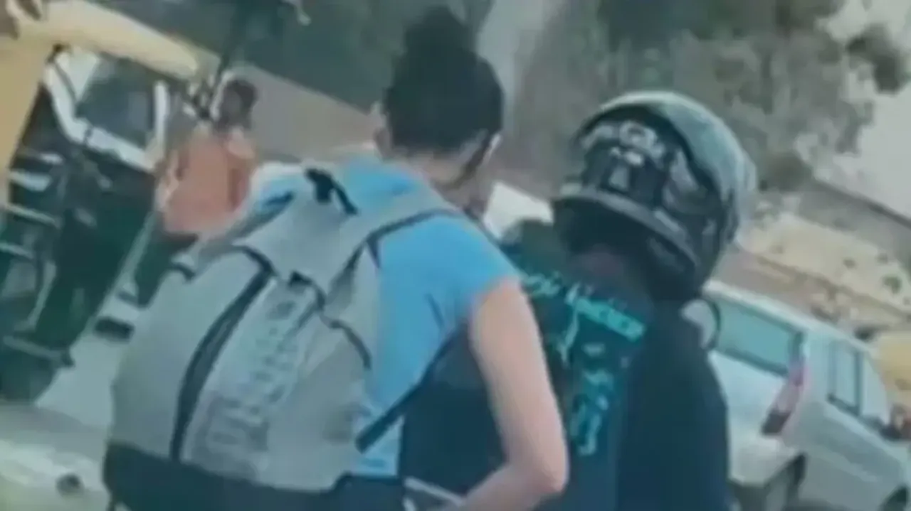 Woman Works On Laptop While Riding Pillion