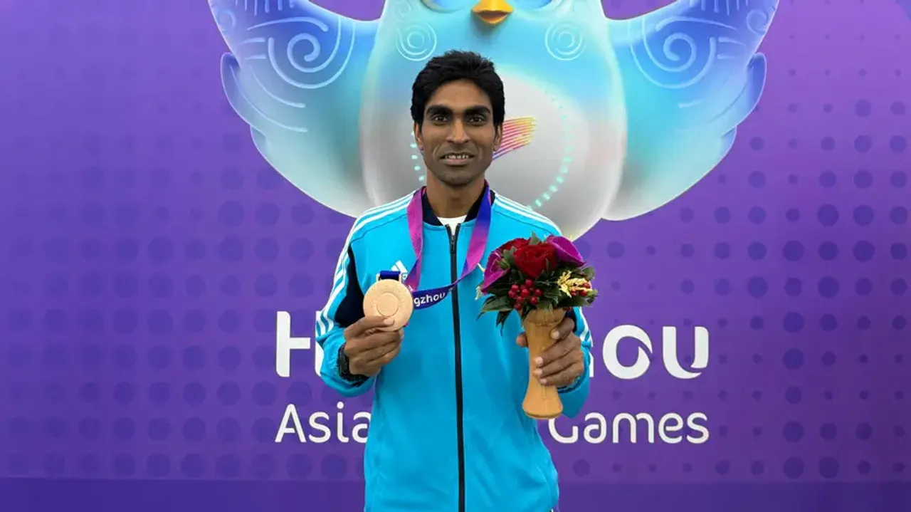 Pramod Bhagat poses with gold medal