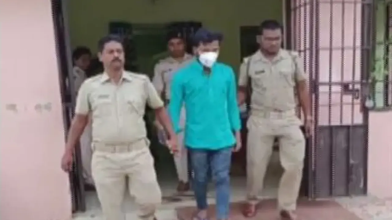 The accused being taken to the police station.