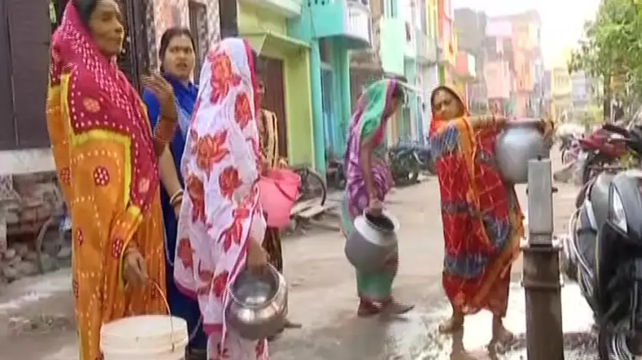Berhampur Residents Collect Water From Tubewell