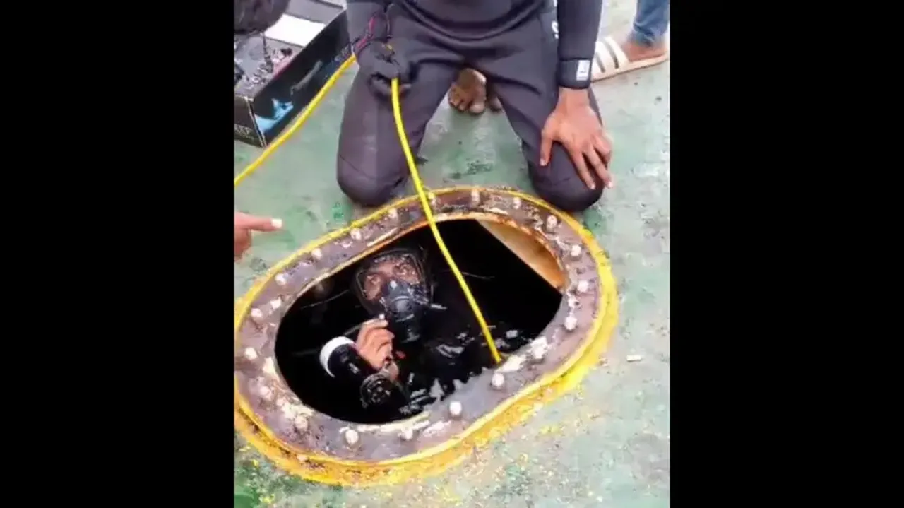 Divers Search For Hidden Cocaine Under The Ship