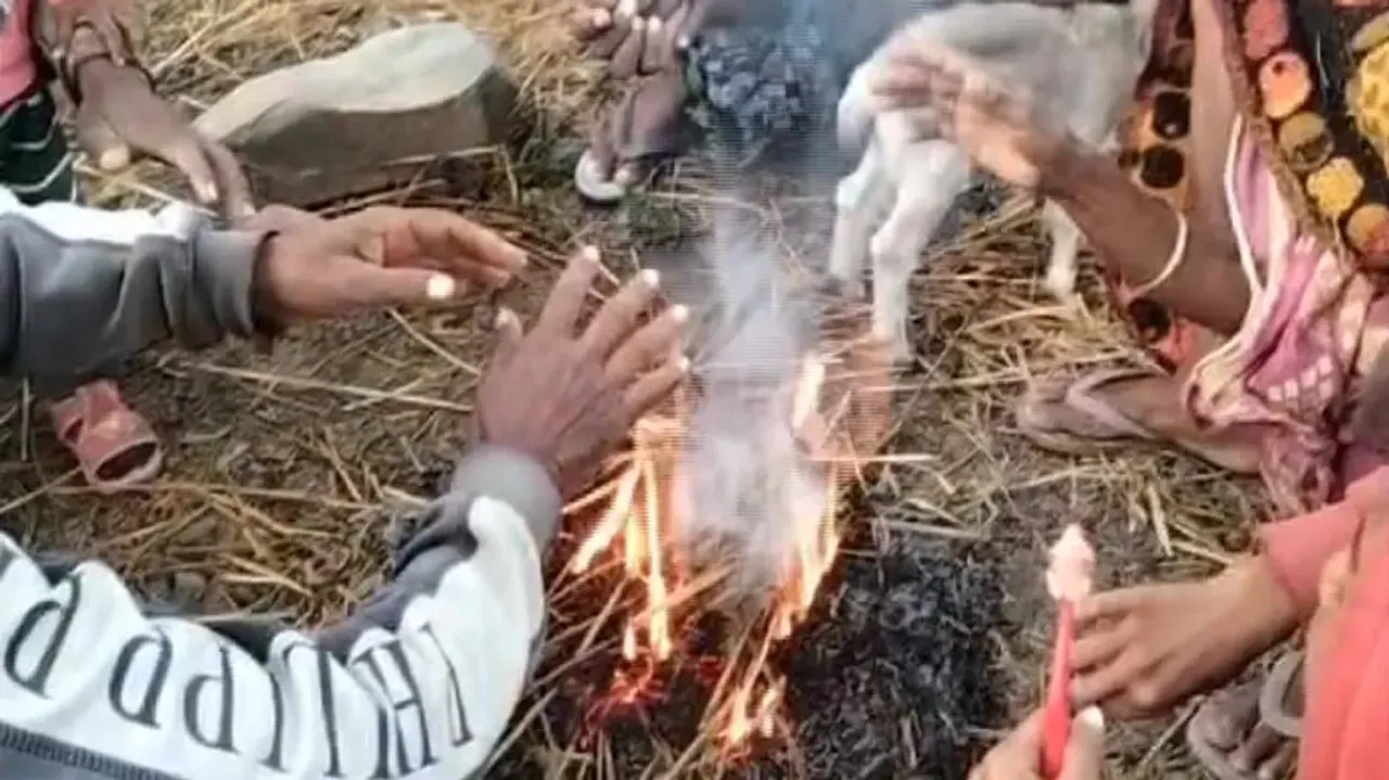 People Light Camp Fire Beside The Road